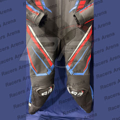 Black leather motorcycle racing suit with red and blue geometric accents, displayed flat against a blue background with a repeating 'Racers Arena' watermark.