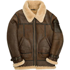 A brown leather aviator jacket with a thick beige shearling collar, lining, and cuffs, featuring a front zipper, two large patch pockets, and adjustable cuff straps.